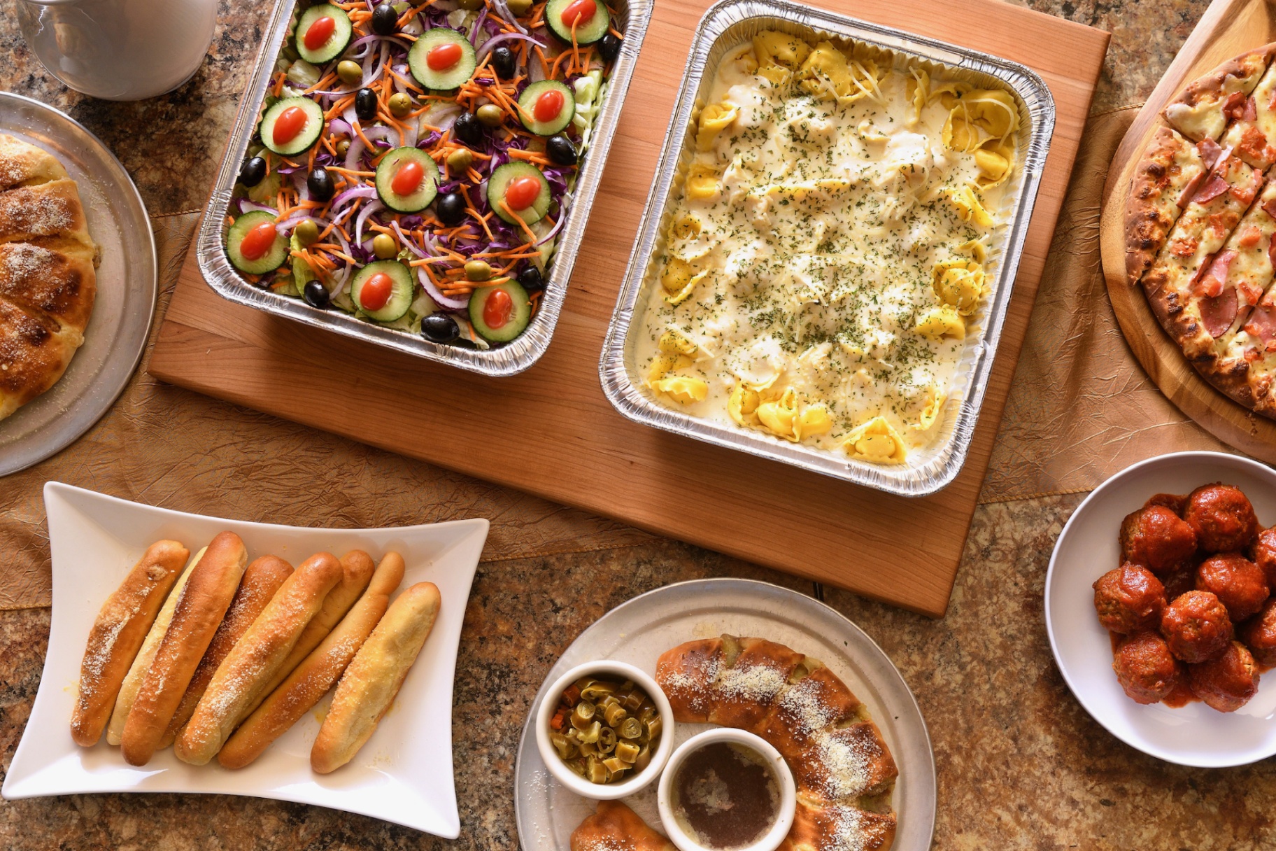Tortellini alfredo, salad, breadsticks and meatballs